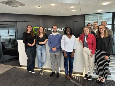 Group photos of people standing by Viriden front desk at its office location in Crawley, ITOPF and Viridien staff pictured
